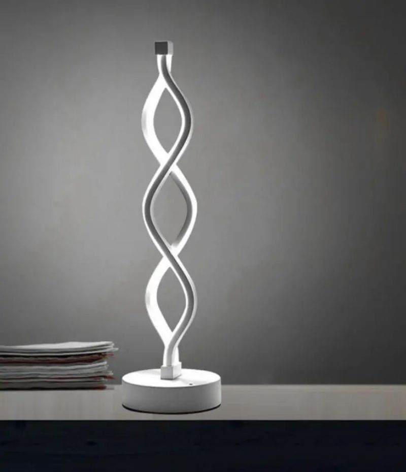 Acrylic LED Desk Lamp with white shell and white light, lit on a desk